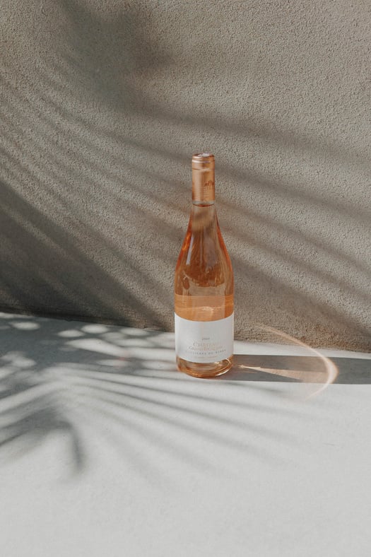 Clear Glass Bottle on Gray Textile