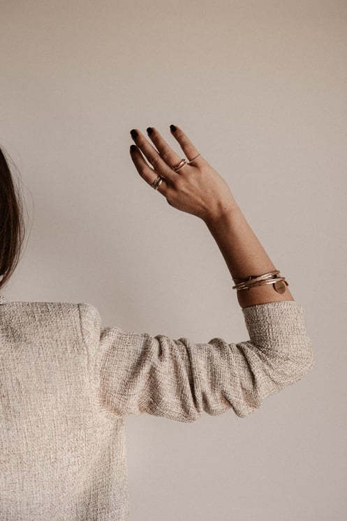 Woman in White Sweater Covering Her Face